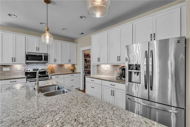 112 Gleneagles, Smithfield, VA 23430 - kitchen with stainless steel appliances, white cabinetry, tasteful backsplash, pendant lighting, and recessed lighting
