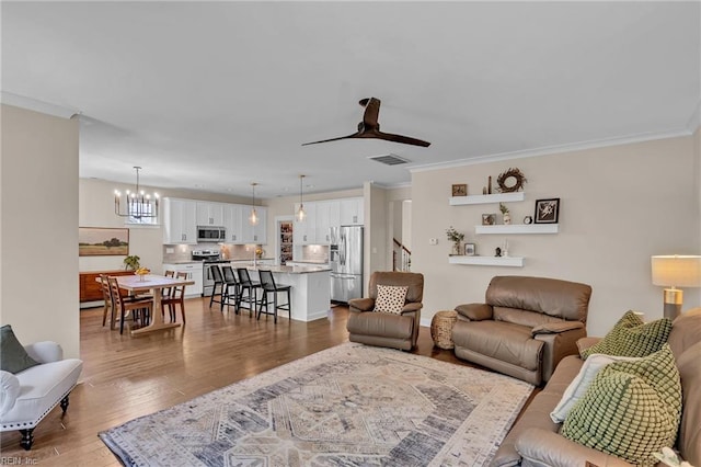 112 Gleneagles, Smithfield, VA 23430 - living room with hardwood / wood-style floors, crown molding, a chandelier, and ceiling fan