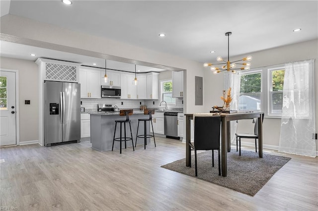21 Rodgers Pl, Portsmouth, VA 23702 - dining room featuring a chandelier, light wood-type flooring, and recessed lighting