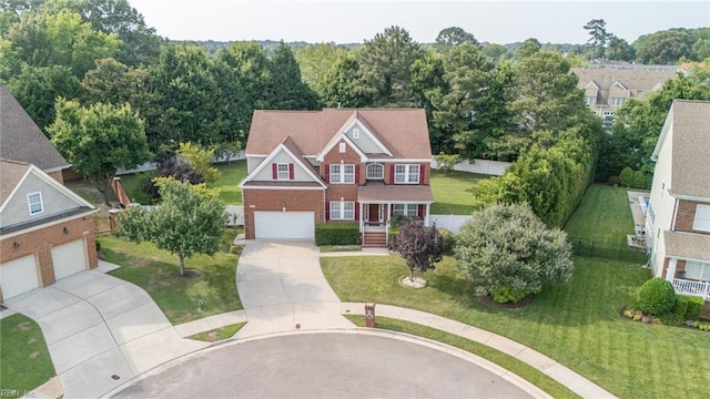 1304 Kemp Bridge Dr, Chesapeake, VA 23320 - view of front of home with concrete driveway, brick siding, and a front yard