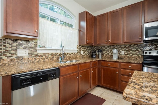 1304 Kemp Bridge Dr, Chesapeake, VA 23320 - kitchen with appliances with stainless steel finishes, stone counters, tasteful backsplash, and light tile patterned floors