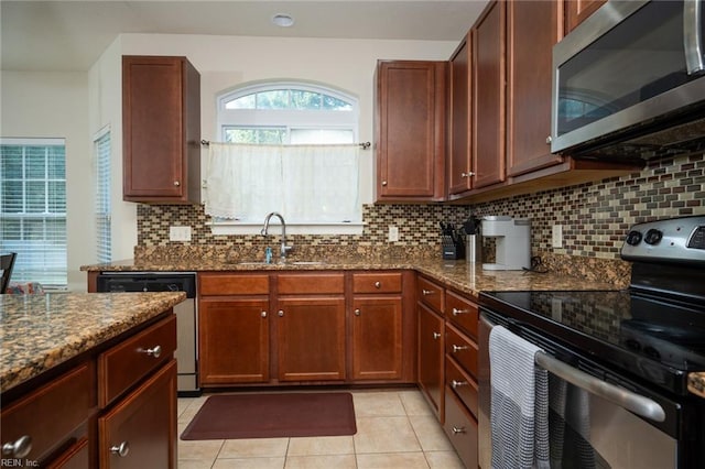 1304 Kemp Bridge Dr, Chesapeake, VA 23320 - kitchen with appliances with stainless steel finishes, dark stone counters, tasteful backsplash, and light tile patterned floors