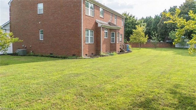1304 Kemp Bridge Dr, Chesapeake, VA 23320 - view of home's exterior featuring brick siding, a yard, and crawl space