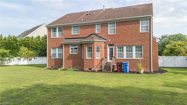 1304 Kemp Bridge Dr, Chesapeake, VA 23320 - back of house with crawl space, brick siding, a fenced backyard, and a gate