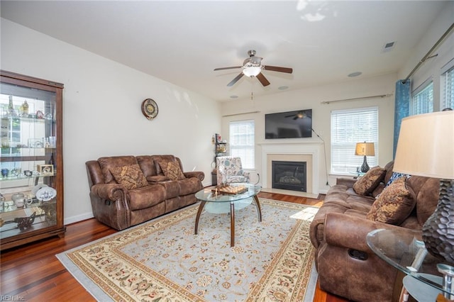 1304 Kemp Bridge Dr, Chesapeake, VA 23320 - living area featuring ceiling fan, wood finished floors, and a fireplace with flush hearth