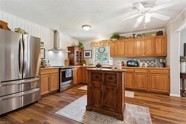 278 Mallard Dr, Hardyville, VA 23070 - kitchen with stainless steel appliances, wall chimney exhaust hood, dark wood-style floors, a kitchen island, and light countertops
