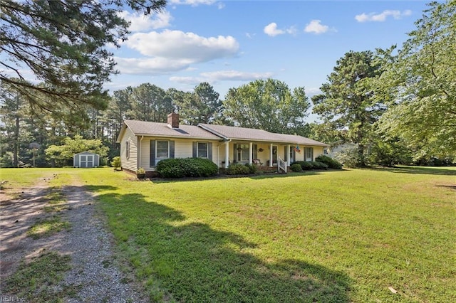 278 Mallard Dr, Hardyville, VA 23070 - ranch-style house featuring a porch, a storage unit, driveway, a chimney, and a front yard