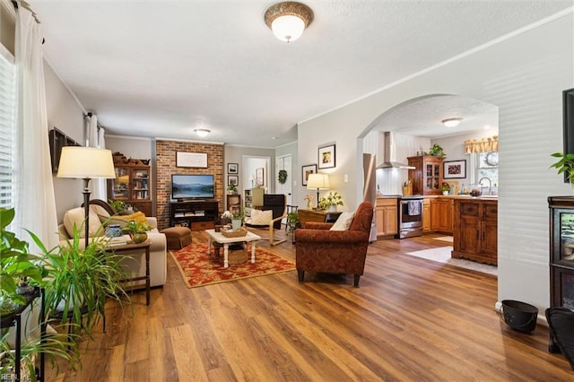 278 Mallard Dr, Hardyville, VA 23070 - living area with wood finished floors, arched walkways, and ornamental molding