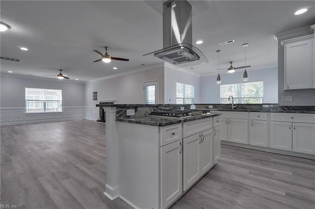 115 Pescara Ln, Newport News, VA 23601 - kitchen with island range hood, stainless steel gas stovetop, ceiling fan, ornamental molding, and open floor plan