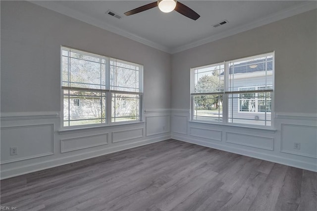 115 Pescara Ln, Newport News, VA 23601 - empty room with wainscoting, a ceiling fan, crown molding, wood finished floors, and a decorative wall