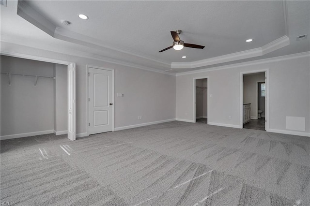 115 Pescara Ln, Newport News, VA 23601 - unfurnished bedroom featuring a tray ceiling, ornamental molding, carpet flooring, recessed lighting, and ensuite bathroom