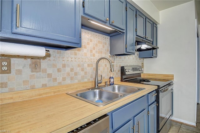 2561 Elon Dr, Virginia Beach, VA 23454 - kitchen with range with electric stovetop, blue cabinets, light countertops, tasteful backsplash, and under cabinet range hood