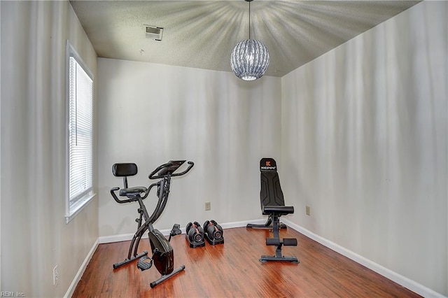 2561 Elon Dr, Virginia Beach, VA 23454 - exercise room with a chandelier and wood finished floors