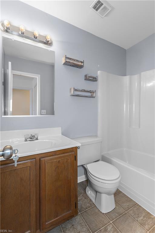 625 Ridge Cir, Chesapeake, VA 23320 - bathroom with vanity, tile patterned floors, and shower / washtub combination
