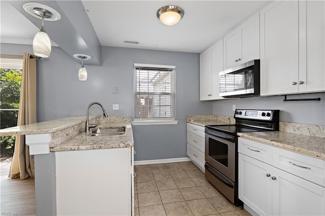 625 Ridge Cir, Chesapeake, VA 23320 - kitchen featuring stainless steel appliances, white cabinets, a peninsula, and light stone counters