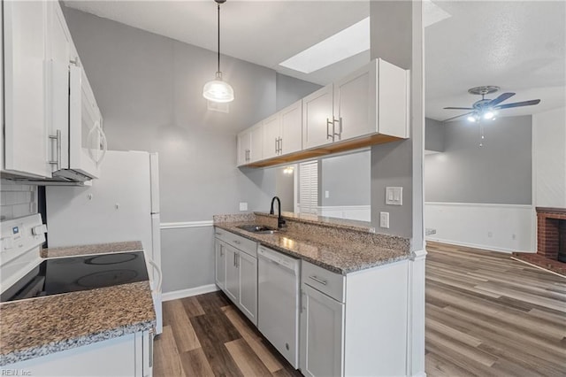 515 Wharf Ct, Virginia Beach, VA 23462 - kitchen with white appliances, dark wood-style floors, ceiling fan, vaulted ceiling, and a skylight