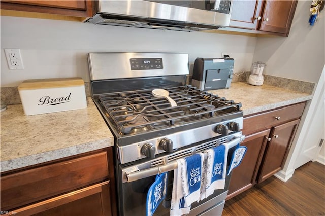 4315 Sconce, Williamsburg, VA 23188 - kitchen featuring stainless steel range with gas cooktop, light countertops, dark wood-type flooring, and brown cabinets