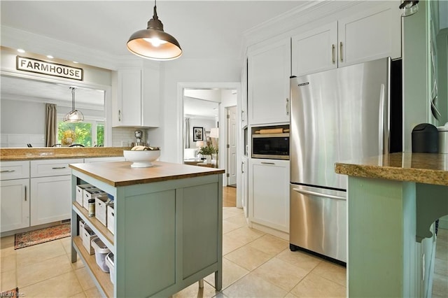 1832 Pitchkettle Rd, Suffolk, VA 23434 - kitchen featuring appliances with stainless steel finishes, butcher block counters, white cabinets, decorative backsplash, and recessed lighting