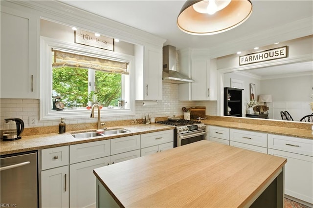 1832 Pitchkettle Rd, Suffolk, VA 23434 - kitchen featuring wall chimney exhaust hood, appliances with stainless steel finishes, white cabinets, tasteful backsplash, and ornamental molding