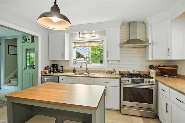 1832 Pitchkettle Rd, Suffolk, VA 23434 - kitchen featuring appliances with stainless steel finishes, wall chimney range hood, white cabinetry, and decorative backsplash