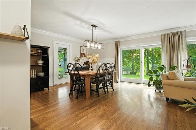 1832 Pitchkettle Rd, Suffolk, VA 23434 - dining room featuring healthy amount of natural light, crown molding, and wood finished floors