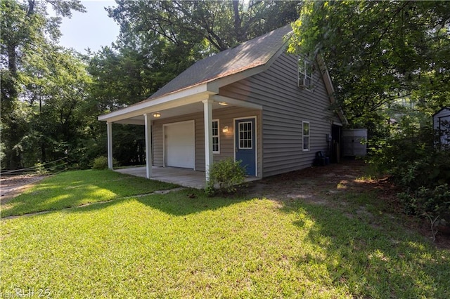 1832 Pitchkettle Rd, Suffolk, VA 23434 - view of property exterior with a lawn and a detached garage