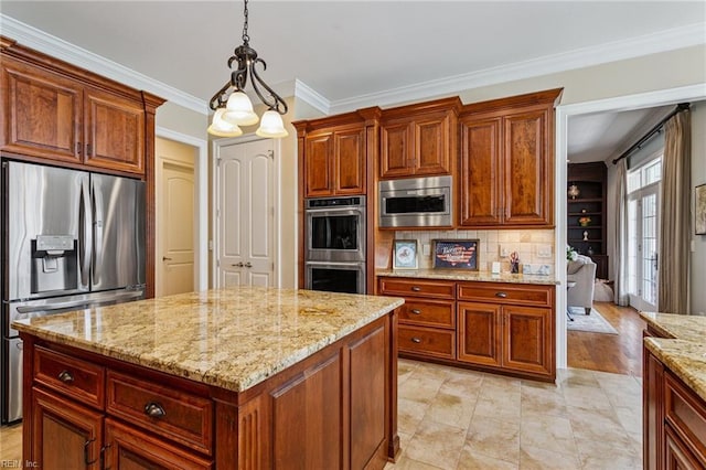 201 Glebe Spring Ln, Yorktown, VA 23693 - kitchen featuring stainless steel appliances, light stone countertops, hanging light fixtures, crown molding, and a kitchen island