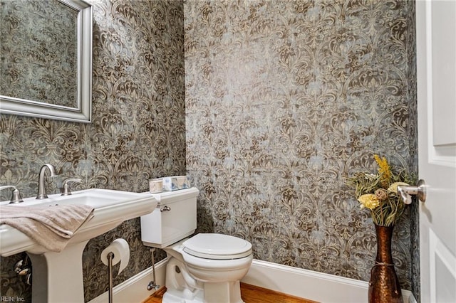 201 Glebe Spring Ln, Yorktown, VA 23693 - half bath with wallpapered walls and wood finished floors