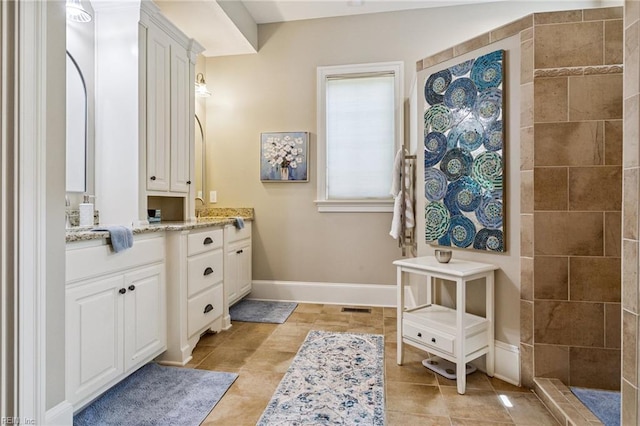 201 Glebe Spring Ln, Yorktown, VA 23693 - bathroom featuring vanity, a walk in shower, and tile patterned floors