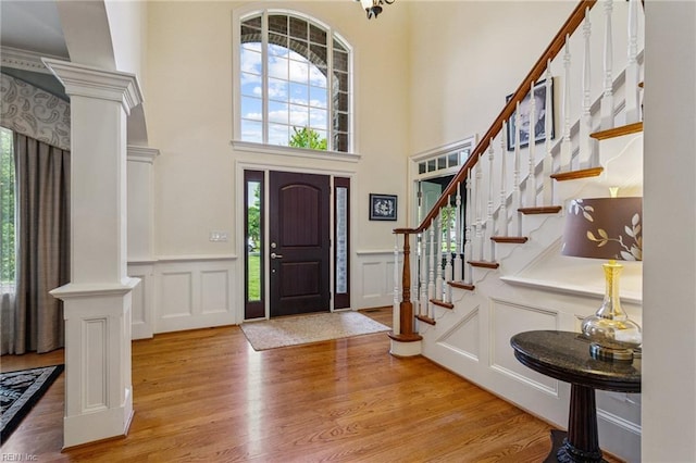 201 Glebe Spring Ln, Yorktown, VA 23693 - entryway with a decorative wall, healthy amount of natural light, light wood finished floors, a towering ceiling, and stairway