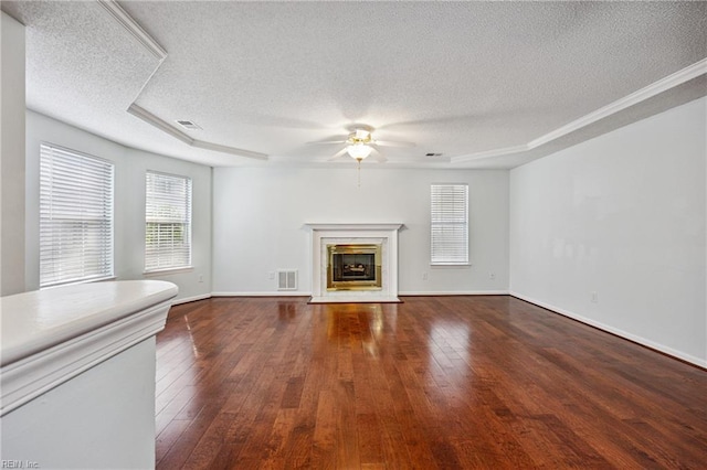 563 Seahorse Run, Chesapeake, VA 23320 - unfurnished living room with a textured ceiling, ceiling fan, a high end fireplace, and dark wood-style floors