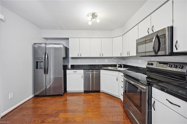 563 Seahorse Run, Chesapeake, VA 23320 - kitchen featuring stainless steel appliances, dark wood-type flooring, and white cabinetry