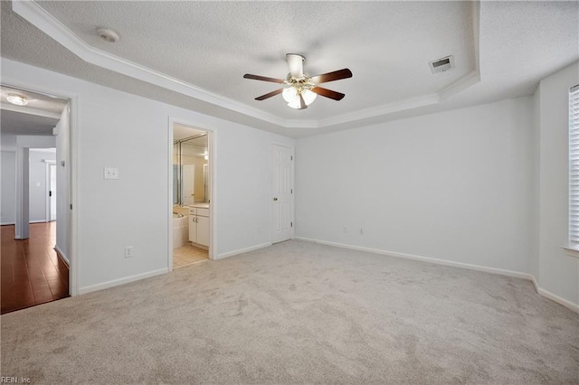 563 Seahorse Run, Chesapeake, VA 23320 - unfurnished bedroom featuring a raised ceiling, light carpet, a textured ceiling, crown molding, and ensuite bathroom