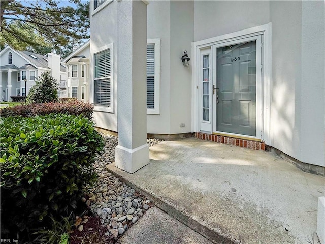 563 Seahorse Run, Chesapeake, VA 23320 - view of exterior entry featuring stucco siding