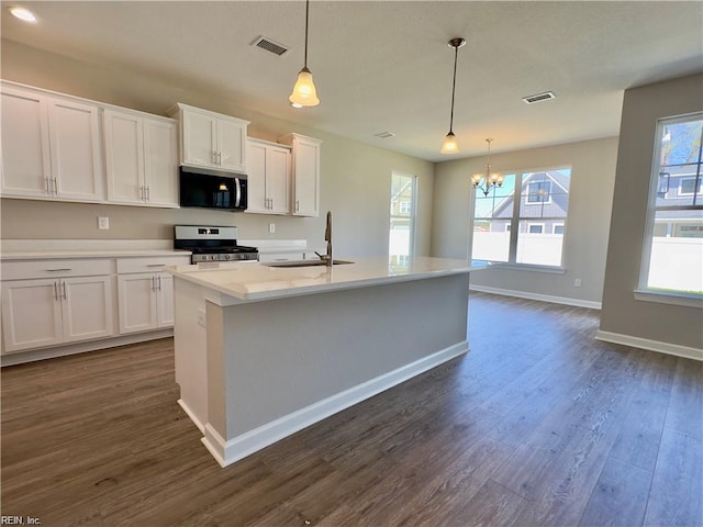 4472 Old Princess Anne Rd, Virginia Beach, VA 23462 - kitchen featuring stainless steel appliances, a chandelier, white cabinets, and dark wood finished floors