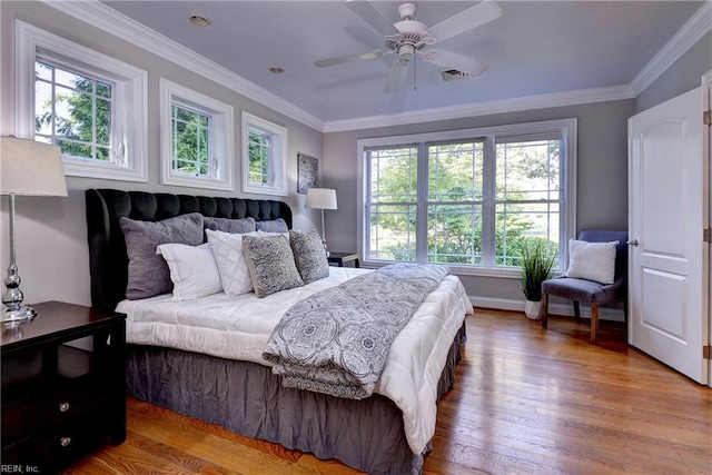 66 Heron Harbor Way, Hudgins, VA 23076 - bedroom with multiple windows, wood finished floors, crown molding, and a ceiling fan