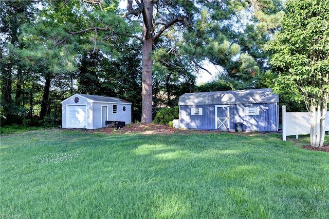 66 Heron Harbor Way, Hudgins, VA 23076 - view of green lawn with a shed and view of wooded area