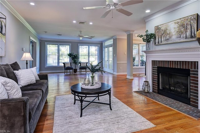 66 Heron Harbor Way, Hudgins, VA 23076 - living area featuring crown molding, ceiling fan, recessed lighting, wood finished floors, and healthy amount of natural light