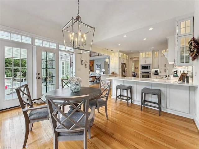 2841 Bennetts Pond Rd, Williamsburg, VA 23185 - dining room featuring a chandelier, light wood finished floors, and recessed lighting