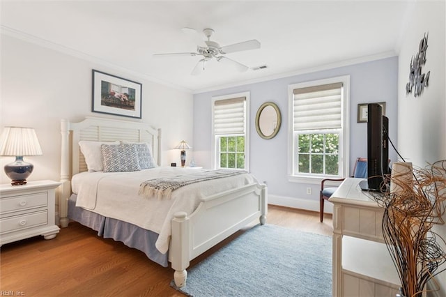 2841 Bennetts Pond Rd, Williamsburg, VA 23185 - bedroom featuring wood finished floors, ornamental molding, and a ceiling fan