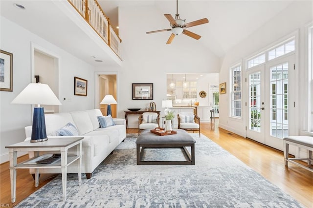 2841 Bennetts Pond Rd, Williamsburg, VA 23185 - living room featuring wood finished floors, plenty of natural light, high vaulted ceiling, and a ceiling fan