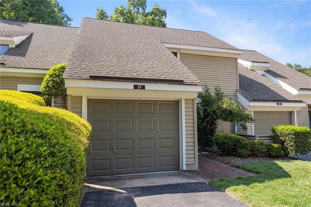 37 Winster Fax, Williamsburg, VA 23185 - view of front facade with a garage, asphalt driveway, and roof with shingles