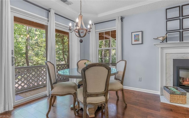 708 Inlet Quay Quay Unit D, Chesapeake, VA 23320 - dining room with healthy amount of natural light, a chandelier, crown molding, wood finished floors, and a premium fireplace