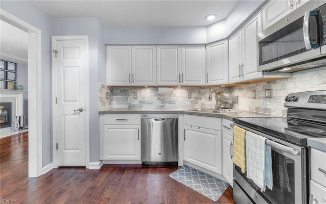 708 Inlet Quay Quay Unit D, Chesapeake, VA 23320 - kitchen with appliances with stainless steel finishes, white cabinetry, stainless steel countertops, and dark wood-style floors