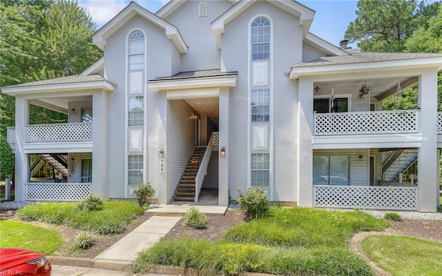708 Inlet Quay Quay Unit D, Chesapeake, VA 23320 - view of front of property featuring stairway, stucco siding, and a balcony