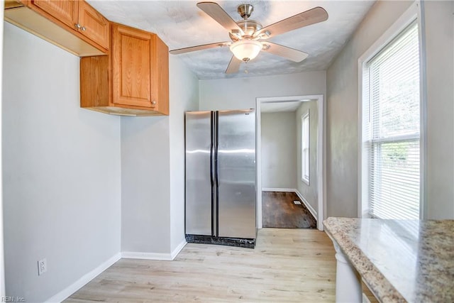 831 Quail Ave, Chesapeake, VA 23324 - kitchen with freestanding refrigerator, light wood-type flooring, light stone countertops, and a ceiling fan