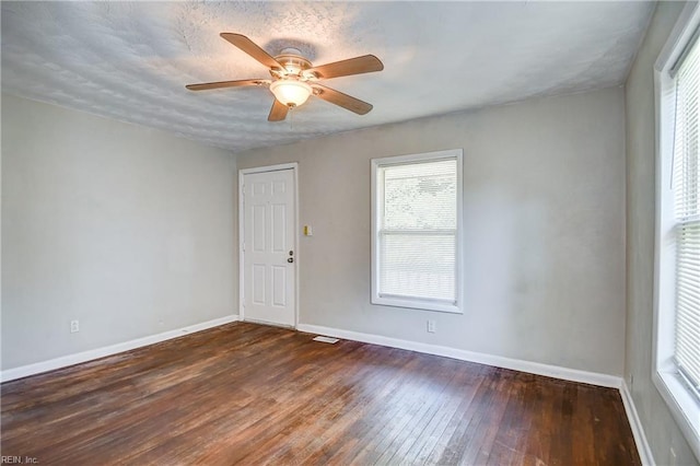 831 Quail Ave, Chesapeake, VA 23324 - empty room featuring healthy amount of natural light, hardwood / wood-style flooring, and a ceiling fan