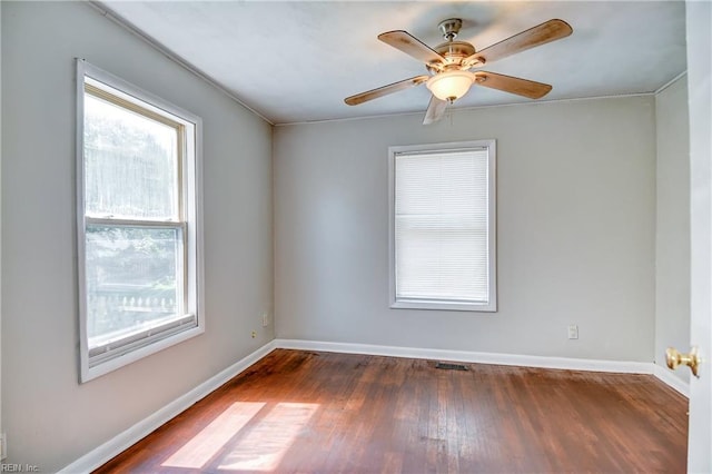 831 Quail Ave, Chesapeake, VA 23324 - empty room featuring healthy amount of natural light, wood finished floors, and ceiling fan