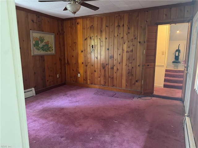 44 Milford Rd, Newport News, VA 23601 - spare room featuring a baseboard heating unit, a ceiling fan, carpet floors, and wooden walls