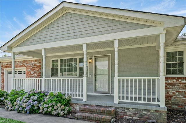 201 Jarvis Rd, Chesapeake, VA 23323 - property entrance featuring a porch and brick siding